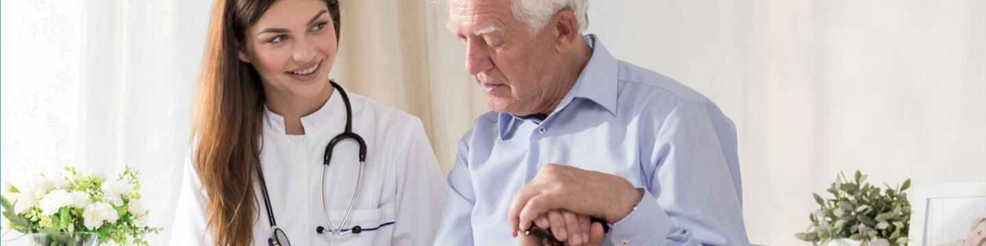 Professional healthcare worker taking care of a senior patient
