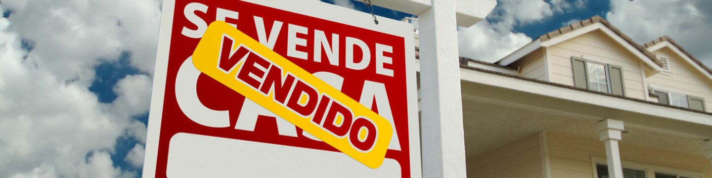 Cartel de vendido de una Agencia Inmobiliaria