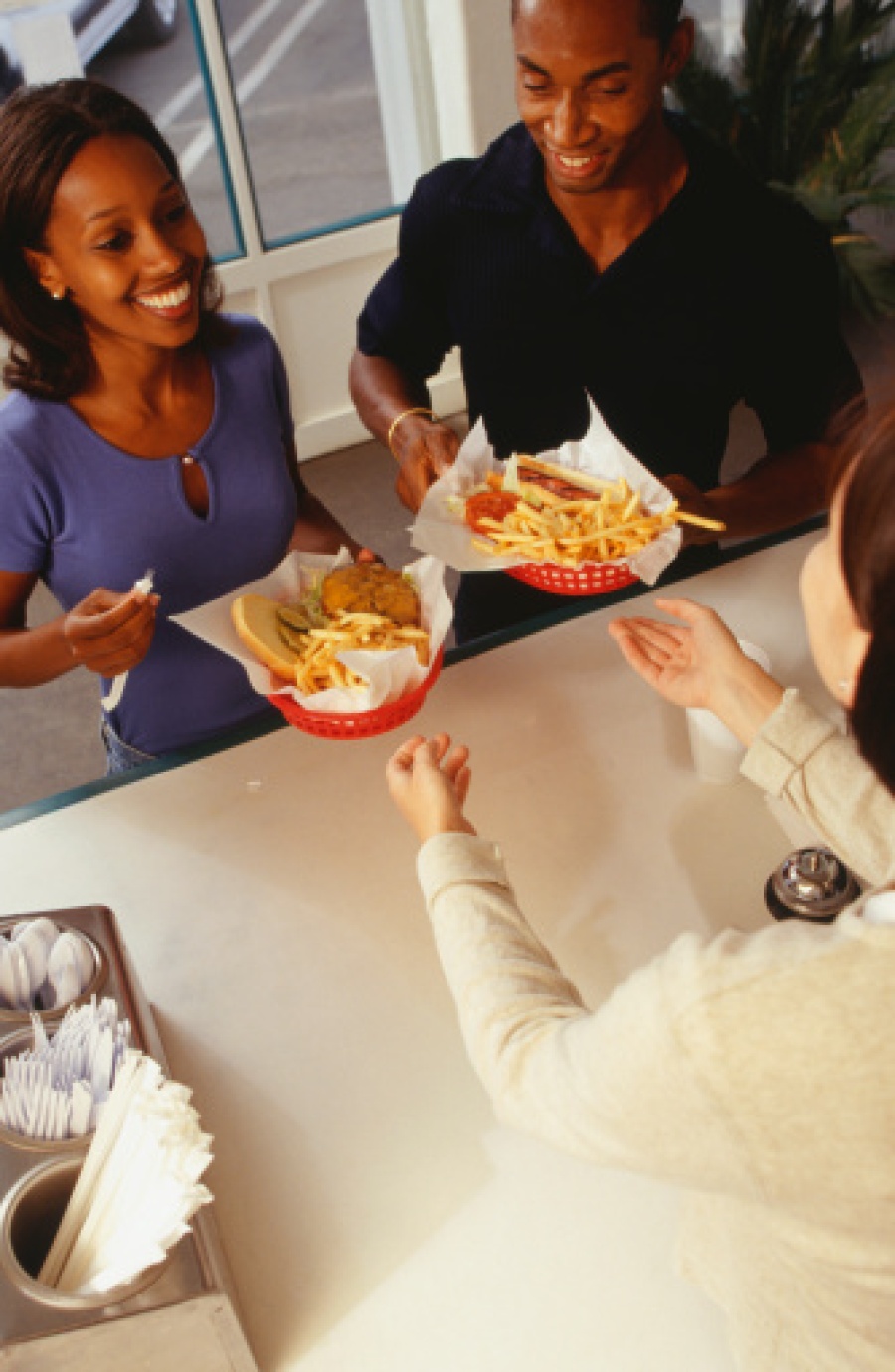 Couple Getting Order at Fast Food Restaurant