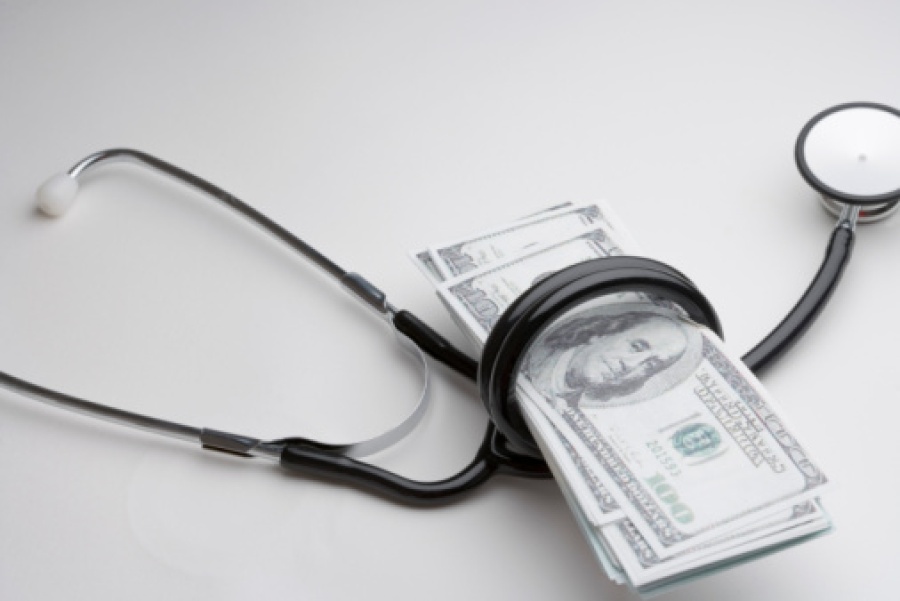 Stethoscope Wrapped Around Hundred Dollar Bills