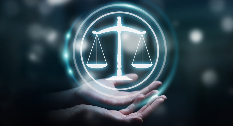 Legal symbol being held in someone's hands.