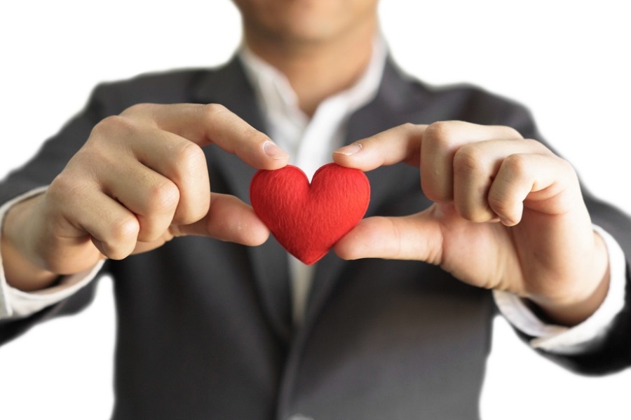 Man in Suit Holding a Heart