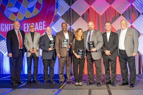 PuroClean Mentor Class honorees with corporate executives at PuroClean's Annual International Convention. From L-R: Bart Meador, Vice Chairman Frank Torre, Chris Tucker, Nigel Belgrave, Becky Edgren, Bob Jordan, Chairman and CEO Mark W. Davis, and President and COO Steve White.