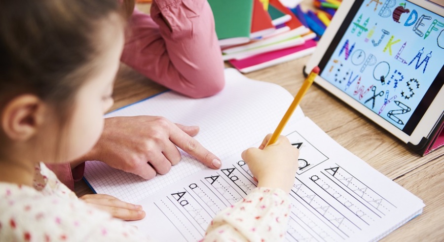 Young girl getting homework help.