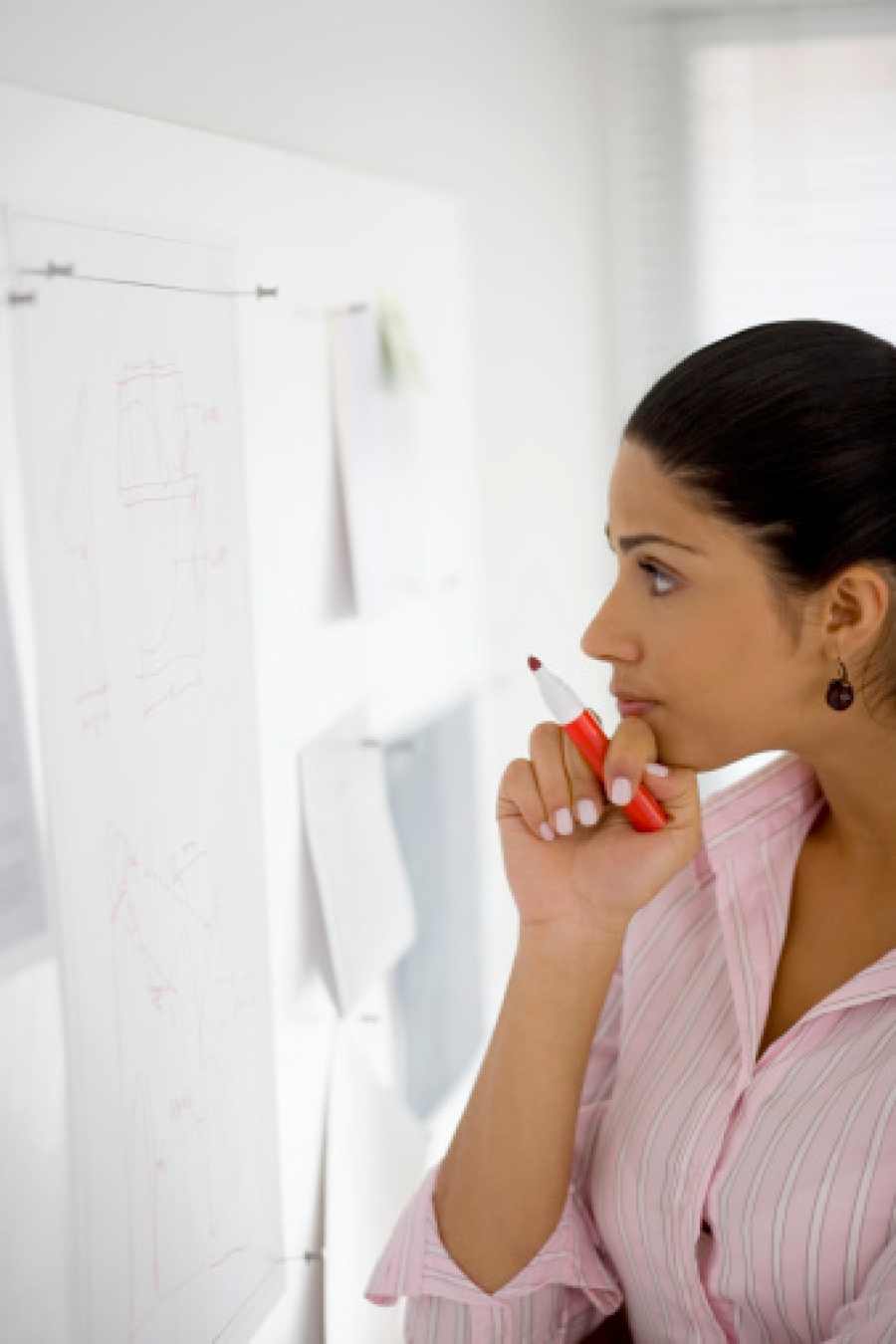 Businesswoman Looking at Design Board