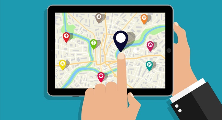 Vector illustration image shows a map on tablet with various pins on the screen. A person's finger is pointing at a pin on the screen.