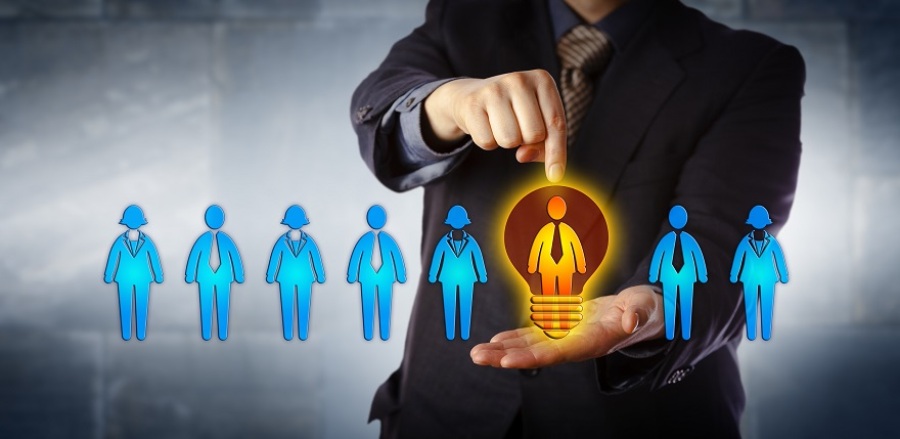 Concept of a manager in a suit choosing the "brightest" candidate from a lineup of candidates.
