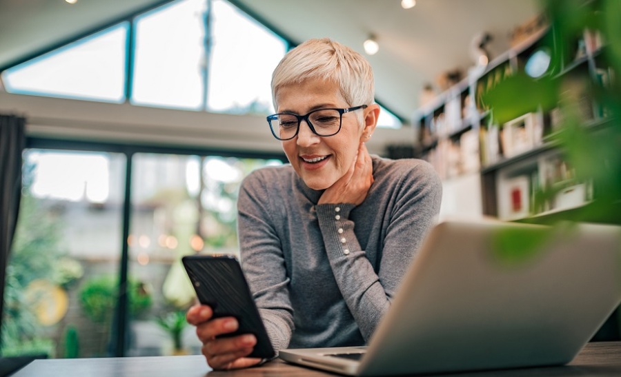 Senior-aged businesswoman working.