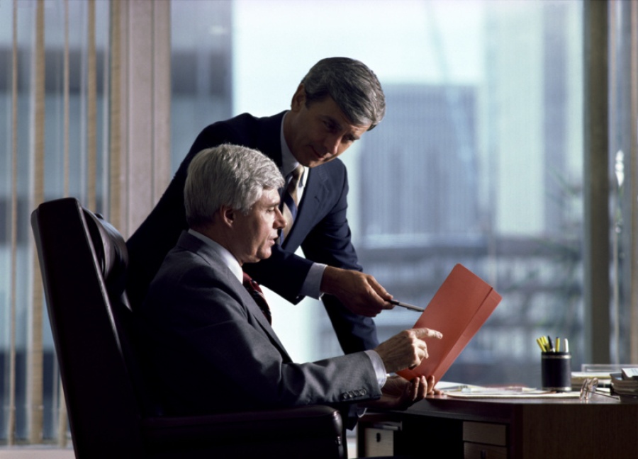 Businessmen Talking in Office