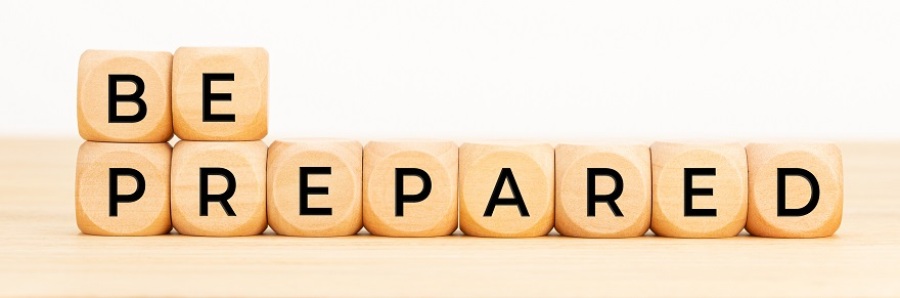 Wooden blocks on a table spelling out "Be Prepared".