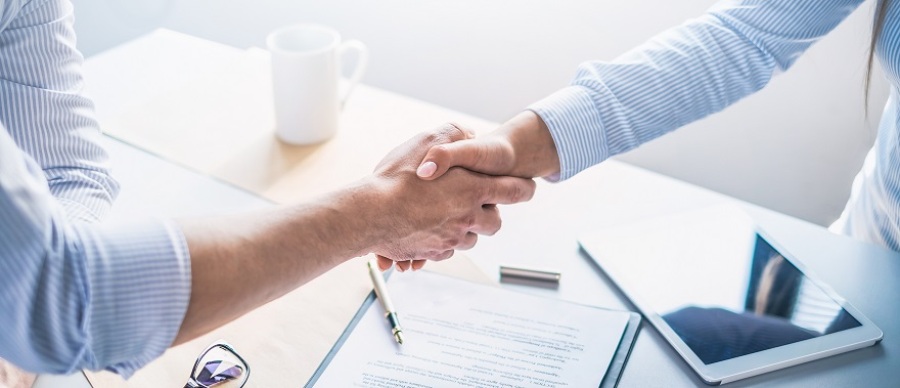 Two businesspeople shaking hands.