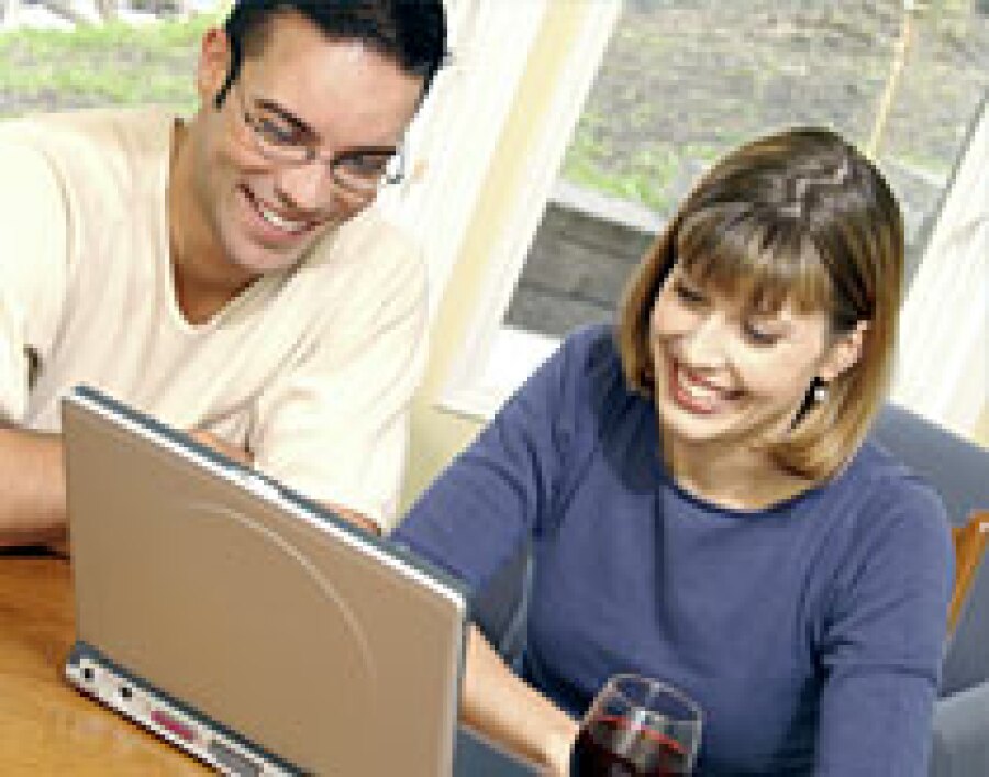 a happy couple searching online