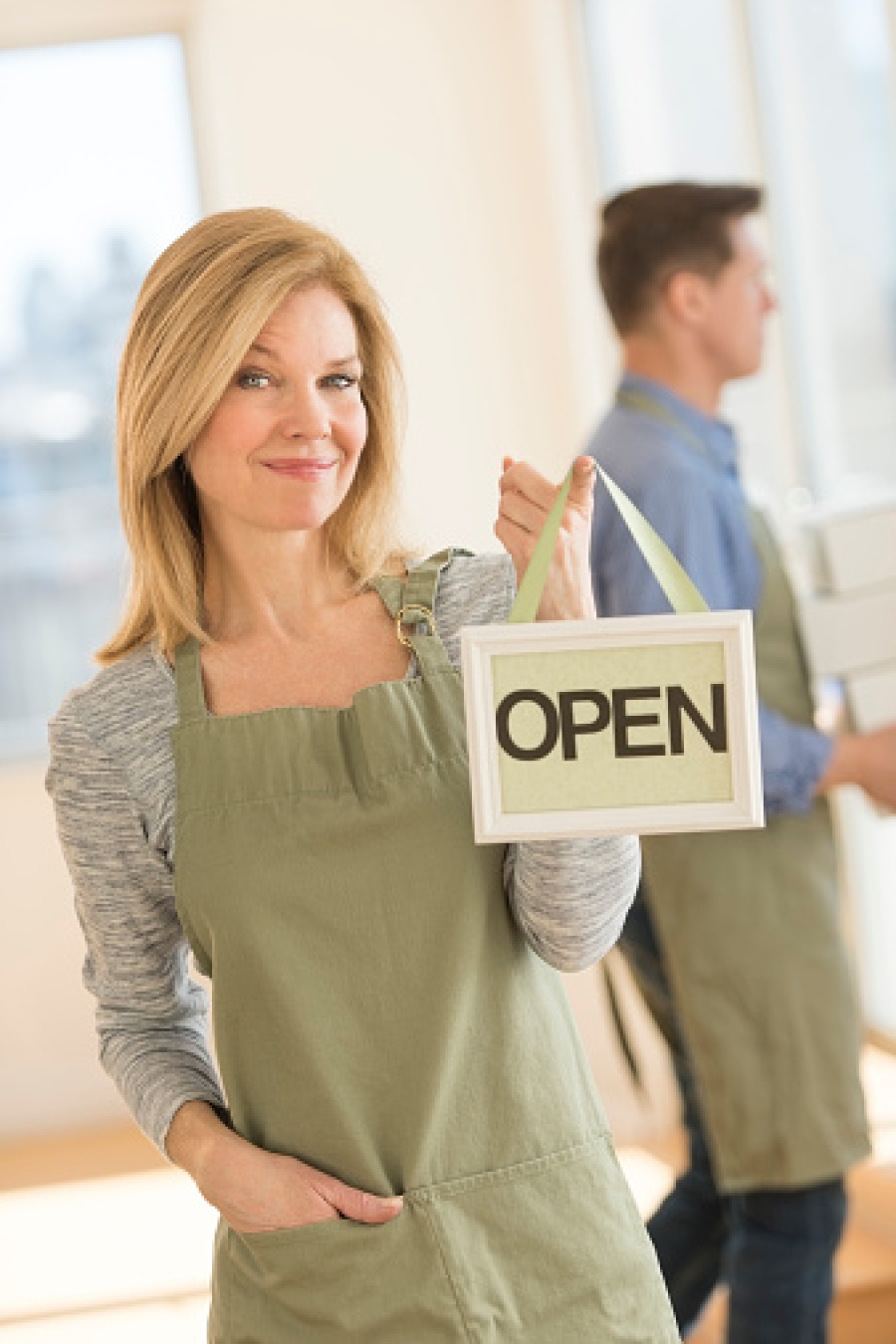 Cafe Owner Holding Open Sign