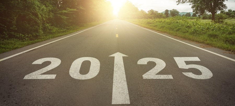 2025 written in the middle of an asphalt road with an arrow pointing forward.