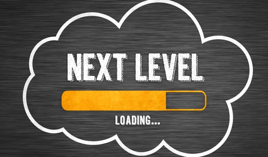Image with the words "Next Level" in a cloud with a bar about 75% filled in and the word "Loading..." underneath.