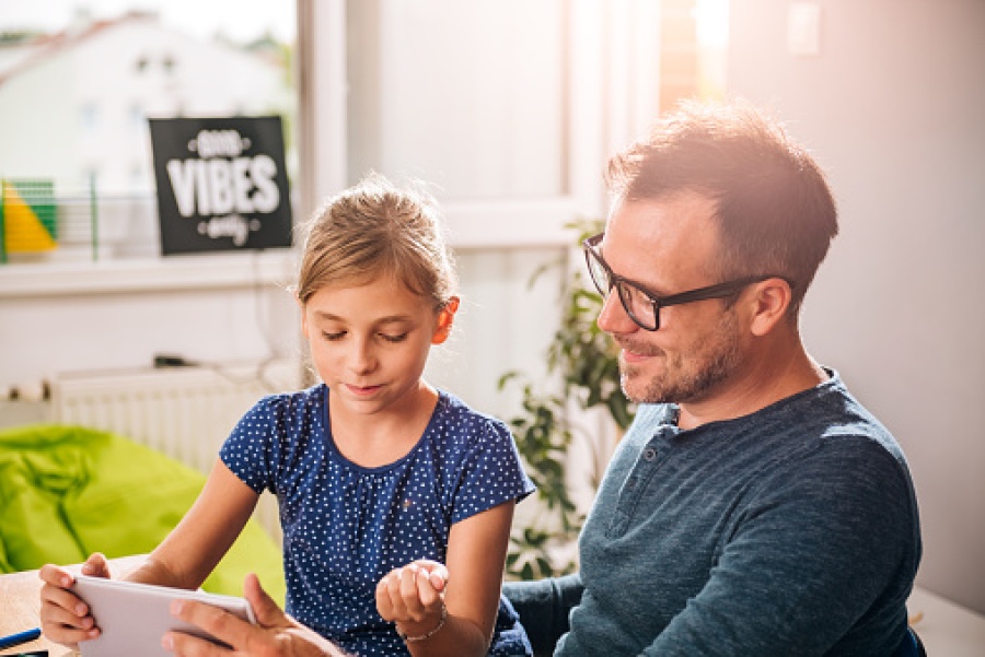 Father and Daughter Using Tablet