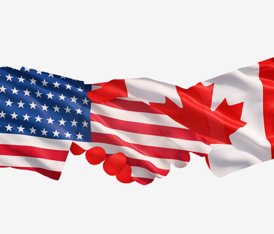 US and Canadian Flags Handshake